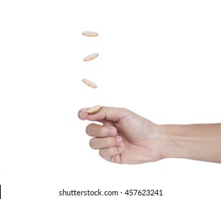 Hand Flip A Coin Isolated On White Background.