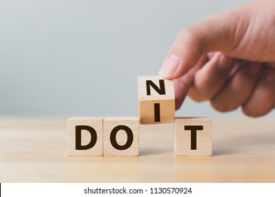 Hand flip wooden cube block with word don’t change to do it. Personal development and career growth or change yourself concept - Shutterstock ID 1130570924