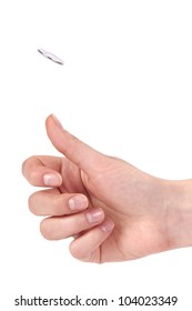 Hand Flipping A Coin  On White Background