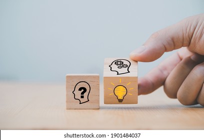 Hand flipping wooden block cube change from human question to smart thinking and solution problem. It is creative thinking idea and innovation concept. - Shutterstock ID 1901484037