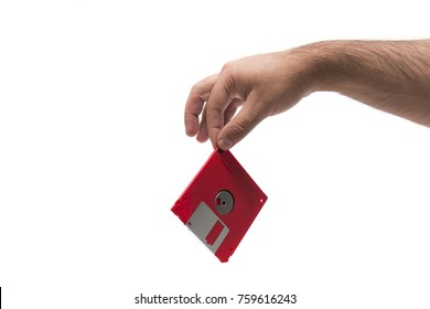 hand with floppy disk isolated on a white background.