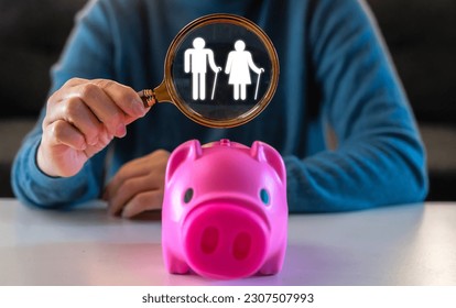 Hand focus family love care protect senior and elderly, elder and piggybank saving money for retired, saving, finance, health, insurance, deposit, investment, bank, senior finance saving plan - Powered by Shutterstock