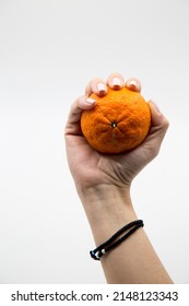 a hand with a fruit