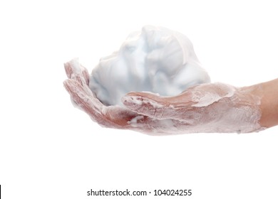 A Hand Full Of Shaving Cream Isolated Against A White Background.