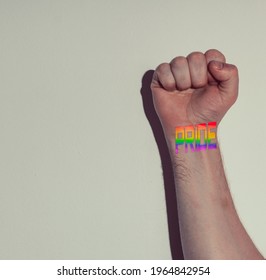 The Hand Of A Gay Boy With A Tattoo That Says Pride Symbol Of Liberation And Sexual Tolerance