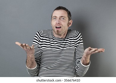 Hand Gesture Concept - Surprised 40s Man Holding Or Displaying Something In Empty Hands In Front Of Him,studio Shot