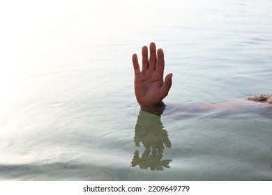 Hand Gesture Of A Sinking Man In The Sea