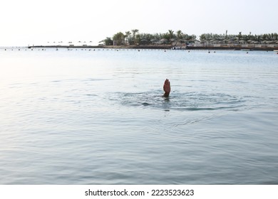 Hand Gesture Of A Sinking Man In The Sea