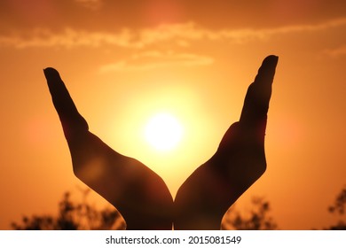 Hand gestures with sunset background - Powered by Shutterstock