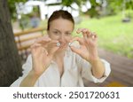 Hand girl holding a dice for a game of backgammon.