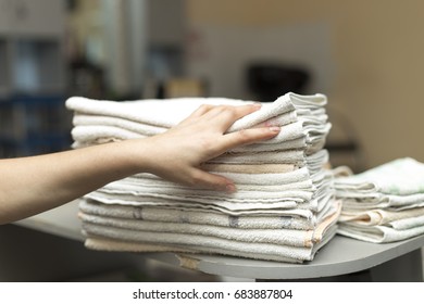 Hand of a girl on folded canvases - Shutterstock ID 683887804