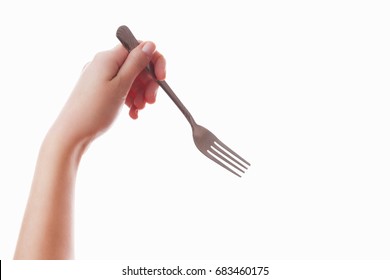 Hand Of A Girl On An Isolated White Background With A Fork