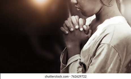 Hand girl praying in the church in vintage tone, Hands folded in prayer concept for faith, spirituality and religion, Coronavirus quarantine concept, food children donation 