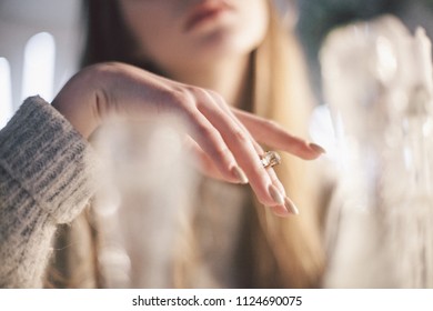 Hand of the girl in a white sweater  - Shutterstock ID 1124690075