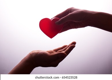 A Hand Gives A Red Heart To A Hand - Blood Donation,world Blood Donor Day