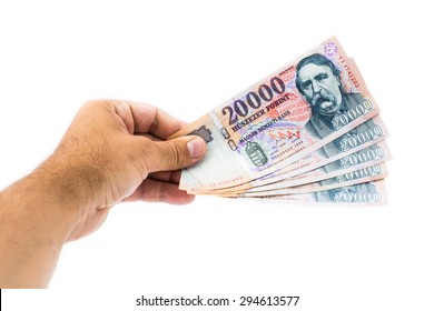 Hand Giving 20000 Forint Banknotes Isolated On White