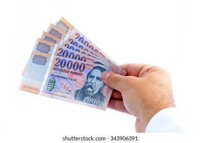 Hand Giving 20000 Forint Banknotes Isolated On White