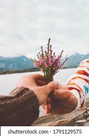 Hand Giving Flowers Bouquet Romantic Couple In Love Dating Travel Outdoor Relationship Lifestyle Vacation In Norway