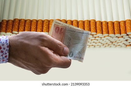 Hand Giving Money To Buy Cigarettes