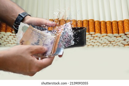 Hand Giving Money To Buy Cigarettes