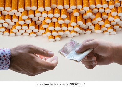 Hand Giving Money To Buy Cigarettes