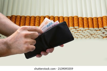 Hand Giving Money To Buy Cigarettes