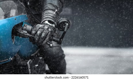Hand in glove on motorcycle handlebar in winter, free space for insertion - Shutterstock ID 2226160571