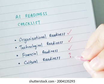 A hand going through the options in the artificial intelligence readiness checklist 