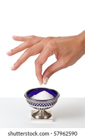 Hand Grabbing A Pinch Of Salt