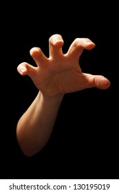 Hand In Grabbing Position Isolated Over Black Background