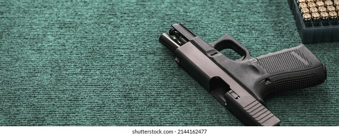 Hand Gun With Ammunition On Military Cloth Background, 9 Mm Pistol Gun Military Weapon And Pile Of Bullets At The Metal Table, Copy Space For Text Concept.