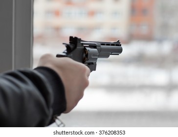 The Hand With The Gun At The Window