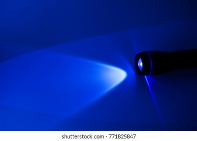 Hand Held Torch On Blue Background Stock Photo 771825847 | Shutterstock