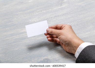 Hand Hold Blank Business Card Design Mockup. Businessman Holding Visiting Card. Business Branding Template. Person In Suit And White Shirt.