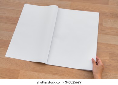 Hand Hold Blank Newspaper With Empty Space Mock Up On Wood Background