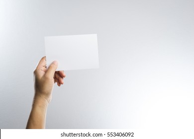 Hand Hold Blank Photo Paper Card  On White Background