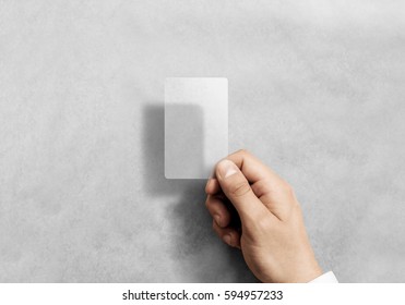 Hand hold blank vertical translucent card mockup with rounded corners. Plain clear call-card mock up template holding arm. Plastic transparent acrylic namecard display front. - Shutterstock ID 594957233