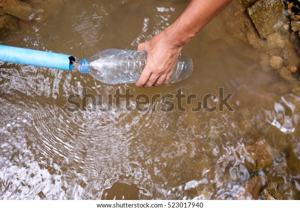 Hand Hold Bottle Fill Bottle Water Stock Photo (Edit Now) 523017940