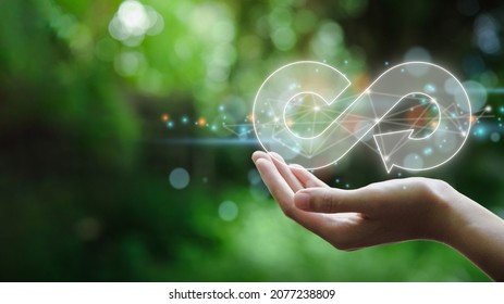 hand hold the circular economy icon. The concept of eternity, endless and unlimited, circular economy for future growth of business and environment sustainable  - Shutterstock ID 2077238809