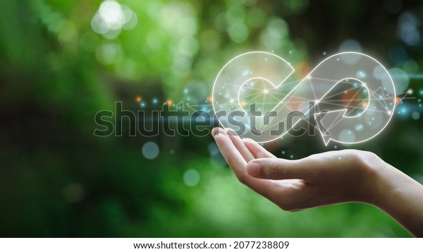 hand hold the circular economy\
icon. The concept of eternity, endless and unlimited, circular\
economy for future growth of business and environment sustainable\
