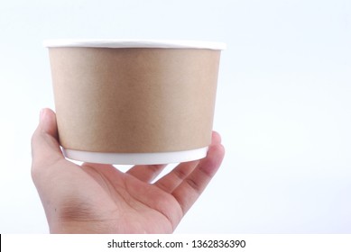 Hand Hold Empty Paper Bowl On White Background