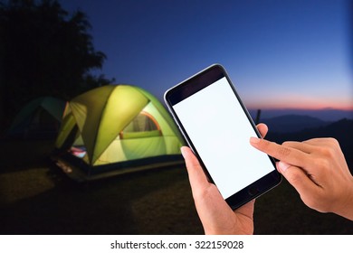 Hand Hold Empty Screen Of Smart Phone On Night Camping Background.