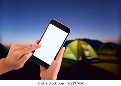 Hand Hold Empty Screen Of Smart Phone On Night Camping Background.