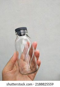 A Hand Hold A Empty Vial Bottle Glass On White Background 