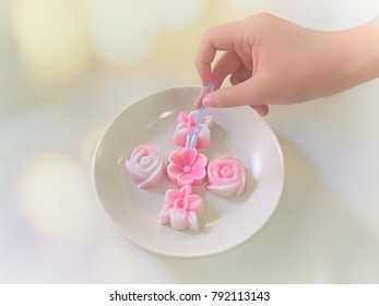 Hand Hold Fork Stab Pink Jelly Mould Flower Shap On Dish