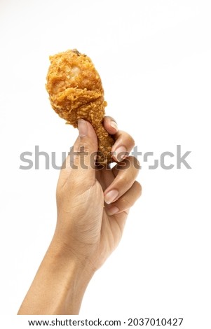 Hand hold fried calf chicken isolated on white background