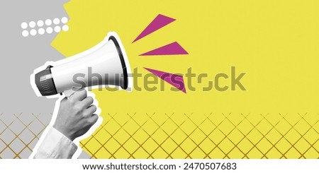 Hand hold megaphone scream on colored background