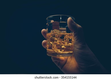 Hand Hold Mug Of Scotch Whisky.