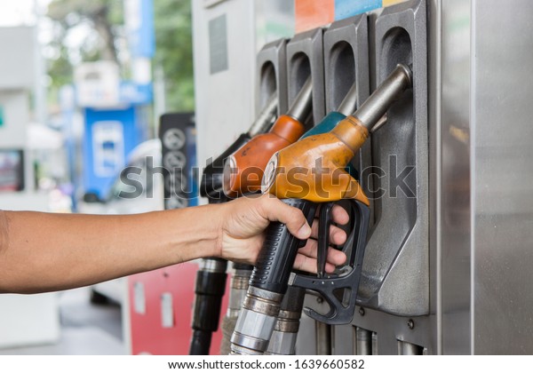 hand\
hold petroleum gasoline on station for\
automotive