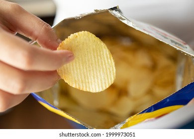 Hand Hold Potato Chips With Snack Bag